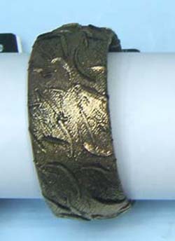 bangle made of plastic with shinning cloth.